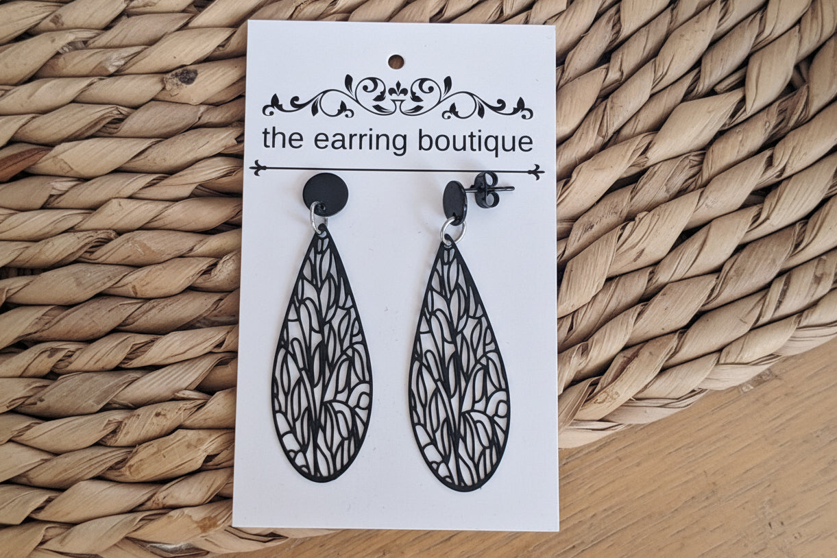 Filigree long tear drop with stainless steel black stud finding